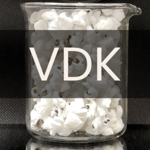White text reading “VDK” placed in front of a clear 250mL beaker containing white popcorn.
